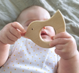Baby holding bird wooden teether